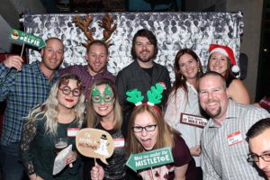 Group of friends at holiday photo booth