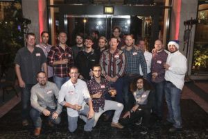 Group of men posing at holiday party