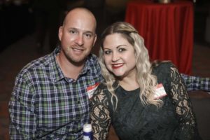 Smiling couple at indoor social event