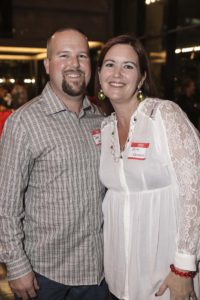 Smiling couple at indoor social event
