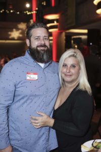 Smiling couple at indoor evening event