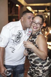 Man kissing woman on cheek at party