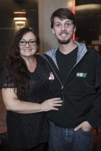 Smiling woman and man posing indoors