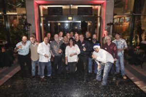 Group of people posing in hotel lobby