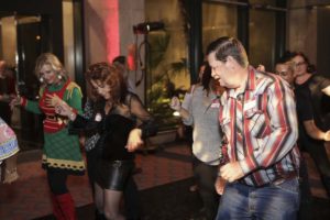 Group of people dancing at indoor party