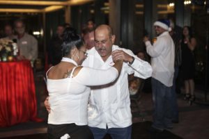 Couple dancing closely at indoor party