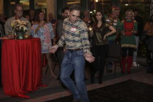 Man dancing at festive holiday party