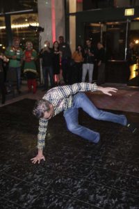 Person performing breakdance move on dance floor