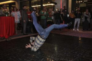 Breakdancer performing headspin on dance floor