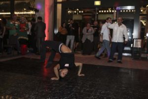 Breakdancer performing backbend on dance floor