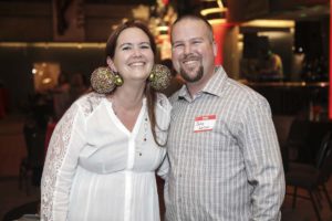 Smiling couple at indoor social event