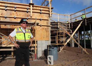Worker in hard hat at construction site