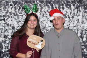 Smiling couple with Santa hat and antlers
