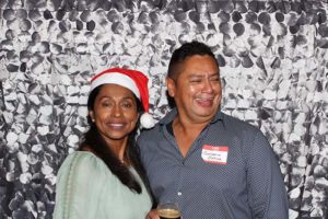 Smiling couple, woman wearing Santa hat