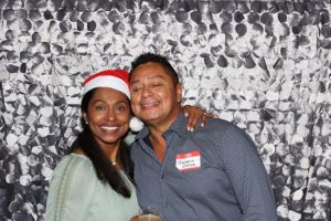 Smiling couple in festive photo booth