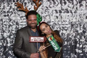 Couple with reindeer antlers and elf headband