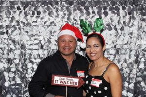 Smiling couple with Santa hat and reindeer antlers