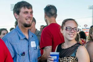 Smiling man and woman at outdoor event