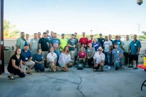 Large group of people posing outdoors