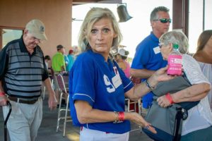 Woman in blue jersey at community event