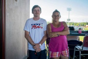 Young man and woman at stadium balcony